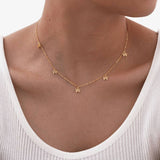 String of Bows Necklace: Gold