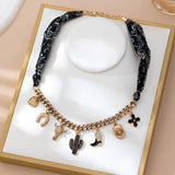 Saddle Up Charm Necklace: Black/Gold