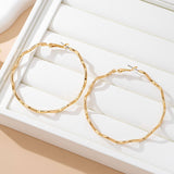 Making Waves Earrings: Gold