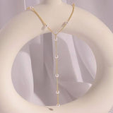 Dripping Pearl Necklace: Gold